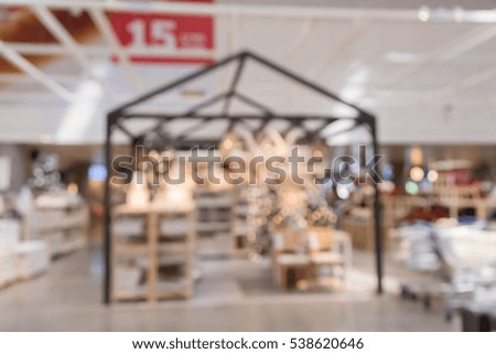 blur picture background of  Christmas and new year display showroom in furniture mall 

