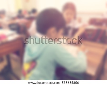 blur kids and teacher in the classroom for background usage.