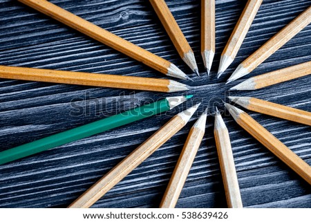 concept selection options with pencils on wooden background top view