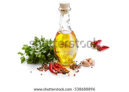 Italian food & drink healthy diet concept: Mediterranean spice vegetable herbs & healthy cuisine. Olive oil chili pepper cayenne pepper garlic  & parsley. Isolated on white  Royalty-Free Stock Photo #538688896