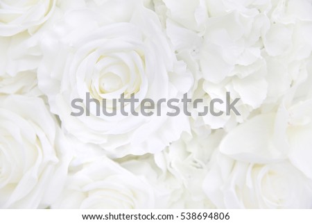 Decoration artificial white roses flower bouquet as a floral background with soft focus and copy space.