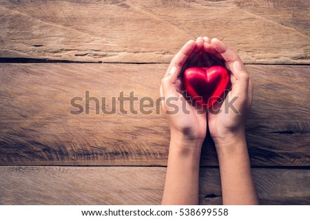 hands female giving red heart Royalty-Free Stock Photo #538699558