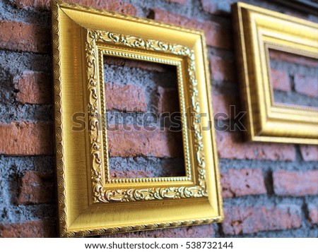 Empty picture frame on the brick wall