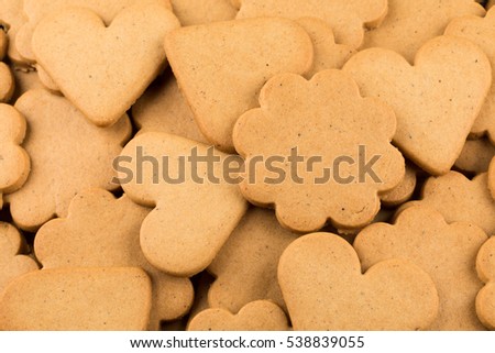 Gingerbread hearts cookies as a background. Christmas decoration.