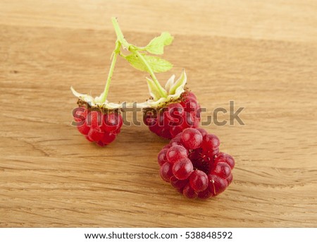 raspberries on a wooden background closeup
