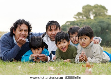Happy Latin family  in the park Royalty-Free Stock Photo #53885656
