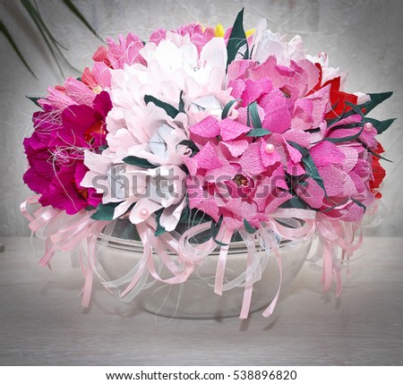 
bouquet of candy, pink peonies with paper in a round vase, crafts