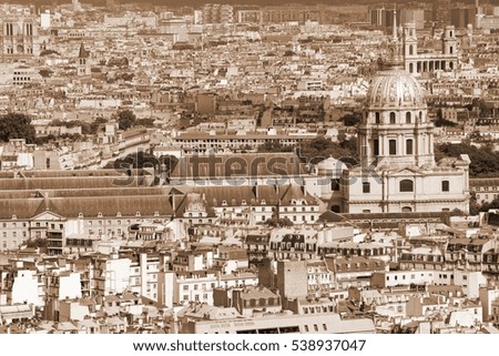 Paris, France - aerial city view with Invalides Palace. UNESCO World Heritage Site. Sepia tone - filtered monochrome photo.