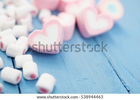 Heart pink marshmallow on wooden pastel tone 