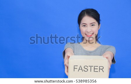 Pretty young girl hold the box to sent the customer by fast with copy space (marketing concept)