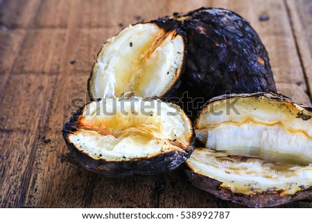 Cassava burn (Manioc)/ manioc on the wood ,scorch cassava grill from Thailand, Asian food. 