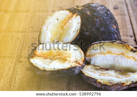 Cassava burn (Manioc)/ manioc on the wood ,scorch cassava grill from Thailand, Asian food. 