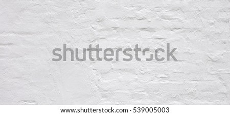 White Rustic Brick Wall Texture. Retro Whitewashed Old Brickwork Surface. Vintage Bricklaying Structure. Grungy Shabby Uneven Painted Plaster In Whiten Facade Background. Abstract Web Banner.