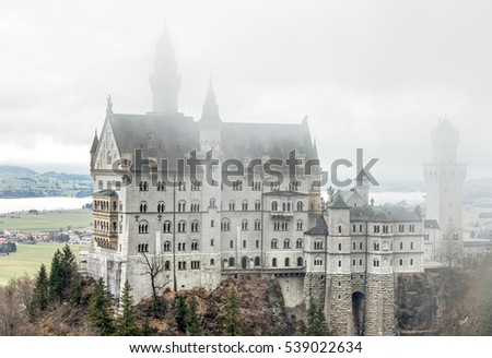 General view of the Neuschwanstein castle in the Bavaria Alps from the bridge in a fog - Tirol, Germany 