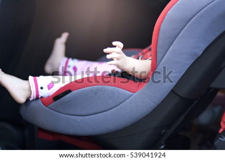 baby sit in safety car seat Royalty-Free Stock Photo #539041924