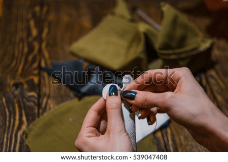 Sewing by hands of the girl, skirt, jacket
