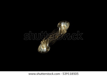 Abstract gold smoke on black background,movement of gold smoke