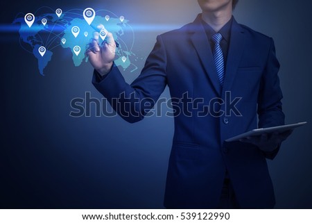 Closeup image of businessman mapping global position with tablet computer