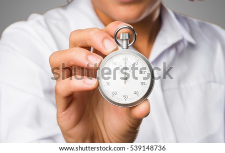 young black woman holding a stopwatch