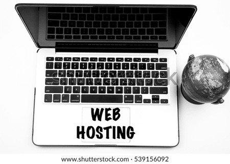 Globe, laptop and WEB HOSTING wording on keyboard, information and technology concept