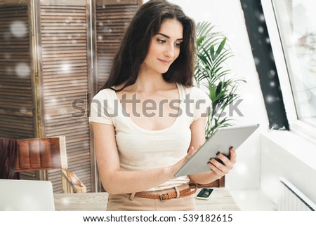 Portrait of an executive professional mature businesswoman sitting office in casual and working with laptop winter snow 