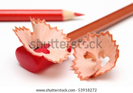 With a red pencil-sharpener and shavings.