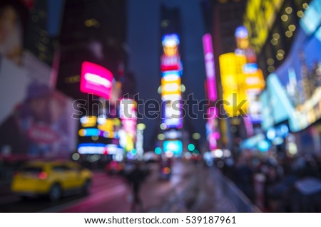 Defocus abstract view of Times Square signage, traffic, and holiday crowds in the lead-up to New Year's Eve after a snowstorm in New York City, USA