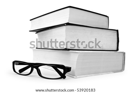 Stack of various books and glasses on white background
