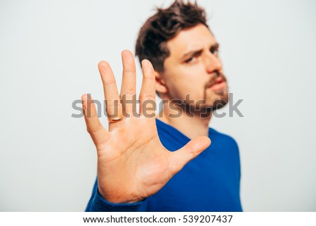 man showing stop