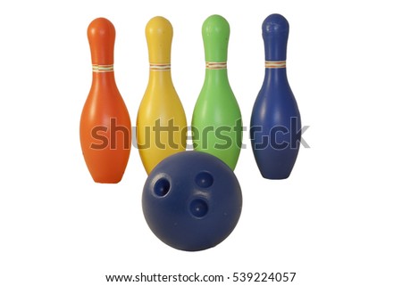 Children's set to play bowling. Ball and colored pins.