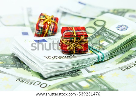 Christmas gifts on the background of the euro/  Money in the photo is the souvenirs are not a means of payment