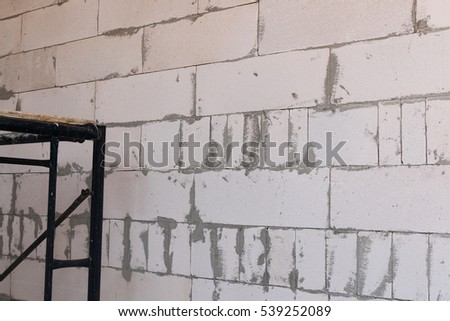 Unfinished house wall made from aerated concrete blocks