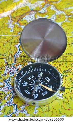 Map with compass. Necessary navigational tools, they will not get lost.