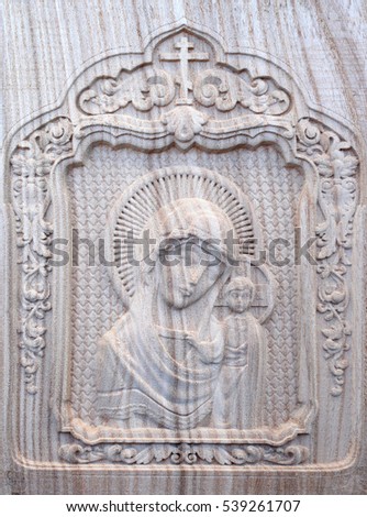 Carving on the, machine with numerical control. Cut cutter machine icon of the Virgin Mary and Jesus.