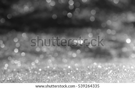 black bokeh abstract background with defocused lights