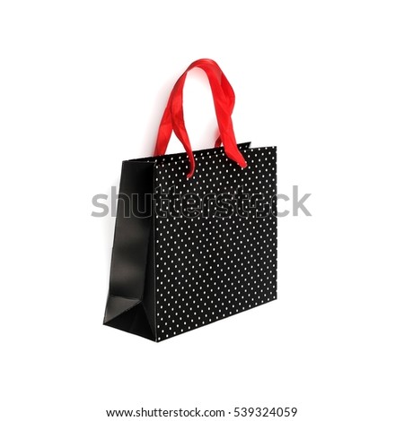 Paper black bag with a red handle isolated on white background