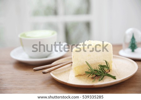 cheesecake japanese style with green tea on wood background