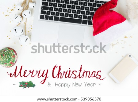 Flat lay, top  view office table desk. Workspace with laptop and christmas decorations on white background and Merry Christmas greetings