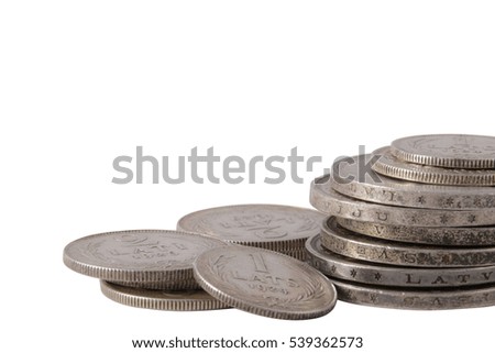 Old Latvian lats silver coin stack isolated on white