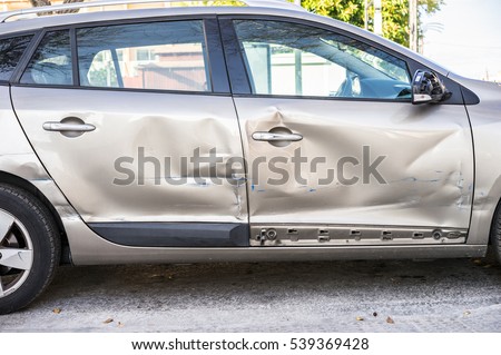 Car body side damage after an road traffic accident.