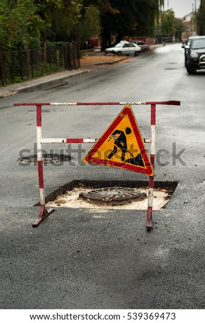 Road closed sign for construction works in street. Road repair sign.