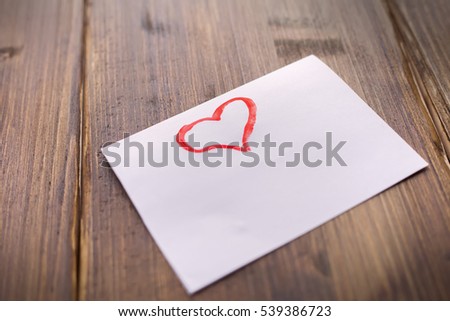 On a white sheet, vintage background, with red paint greetings with Valentine's day