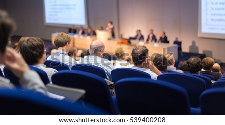 Speaker Giving a Talk at Business Meeting. Audience in the conference hall. Business and Entrepreneurship. Focus on unrecognizable people from rear. Royalty-Free Stock Photo #539400208