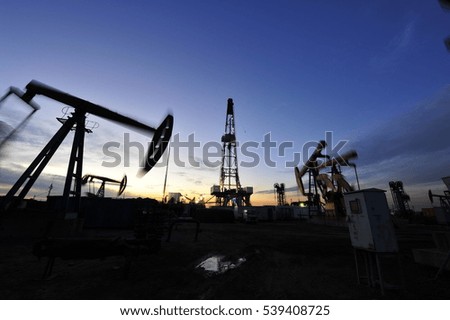 Oil Pump on orange sunset