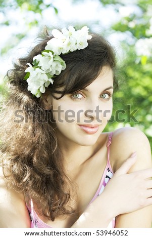 The image of a beautiful girl was blossoming apple orchard