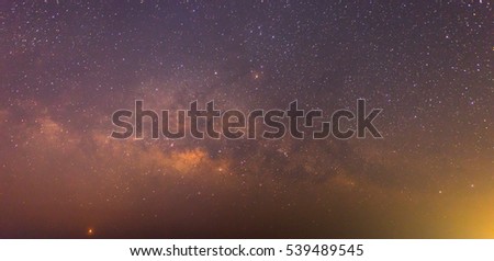 Panorama Milky Way galaxy, Long exposure photograph, with grain and select white balance.