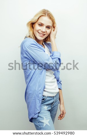 young pretty stylish hipster teen girl posing emotional isolated on white background happy smiling cool smile, lifestyle people concept