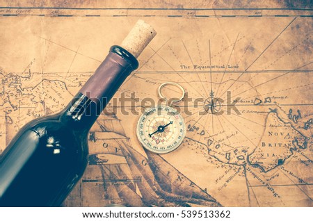wine bottle and compass on vintage map
 Royalty-Free Stock Photo #539513362