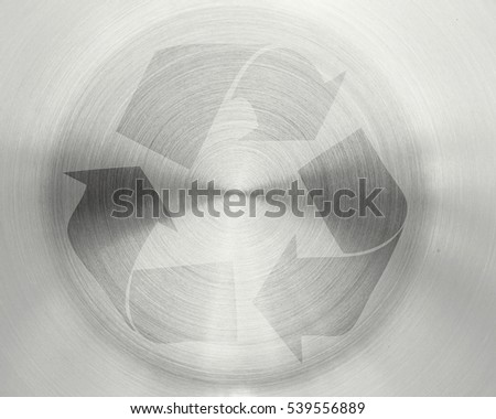 recycle sign on circular metal plate texture background