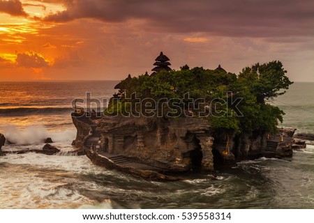 The Pilgrimage Temple of Pura Tanah Lot is perched dramatically on a large coastal rock.